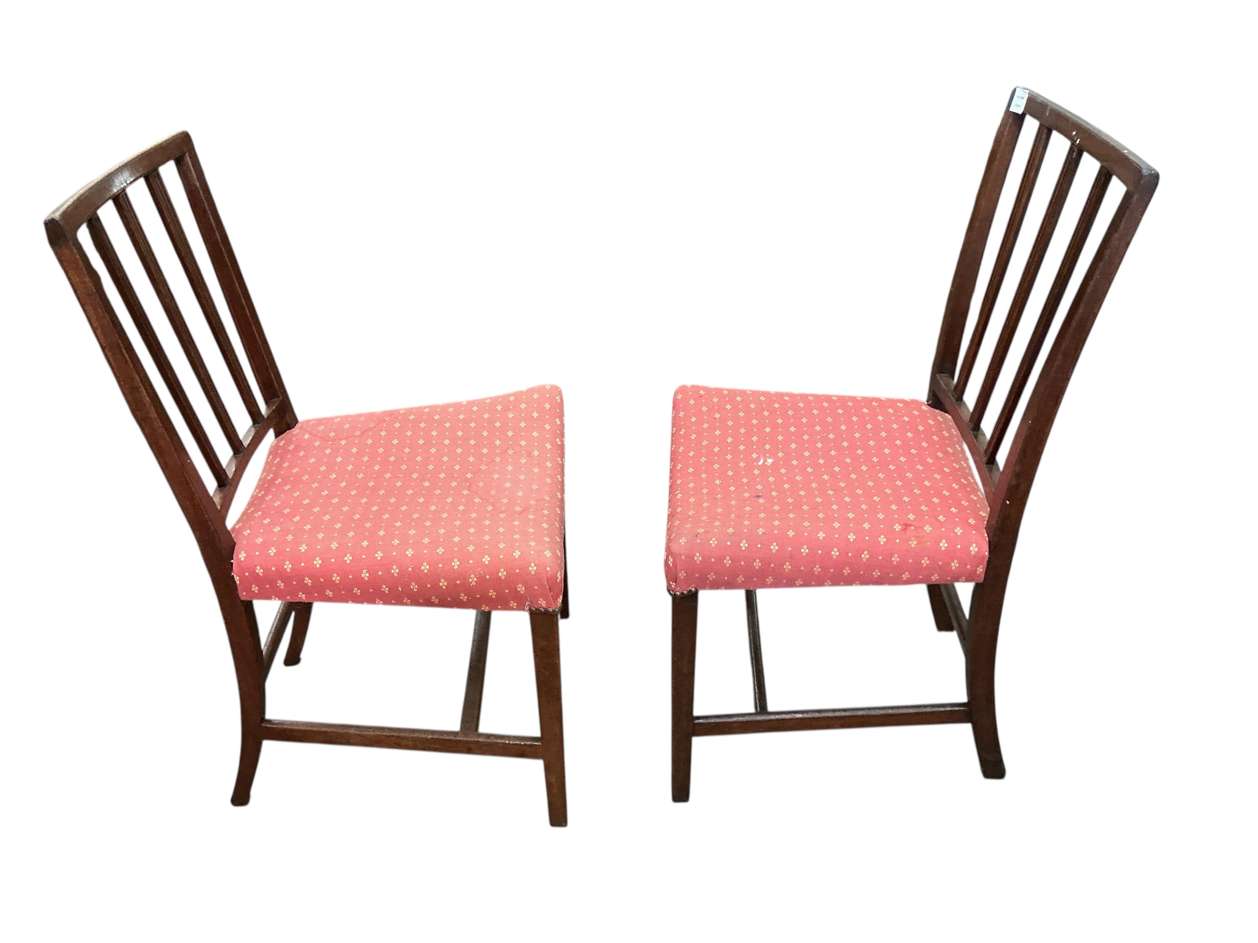 A set of four George III mahogany dining chairs